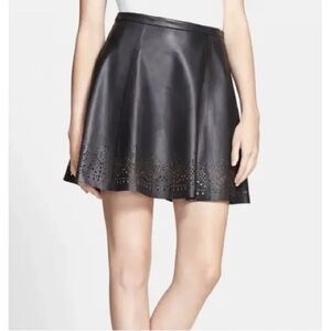 JOIE 100% black genuine leather mini flare skirt with laser cut design.